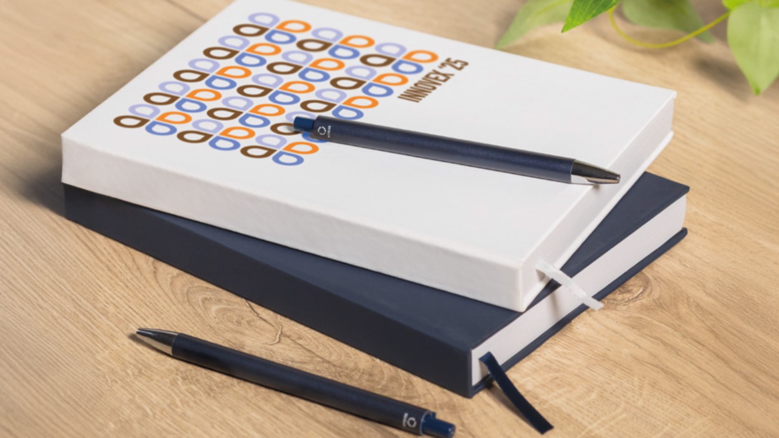 Premium writing kit with geometric design notebook and personalized pens for corporate onboarding